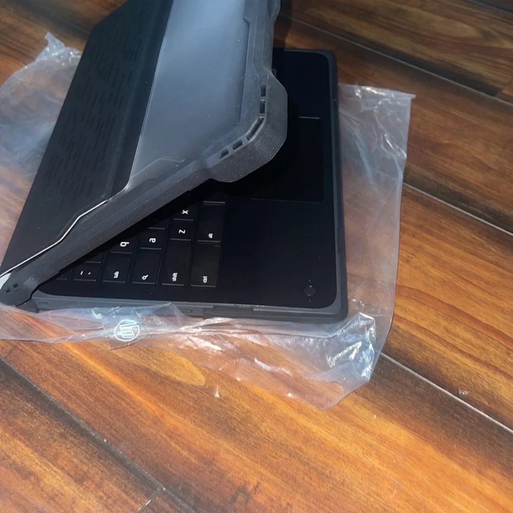 Brand NEW with a Brand NEW CASE TOUCHSCREEN and is adjustable 2-1 laptop/tablet.